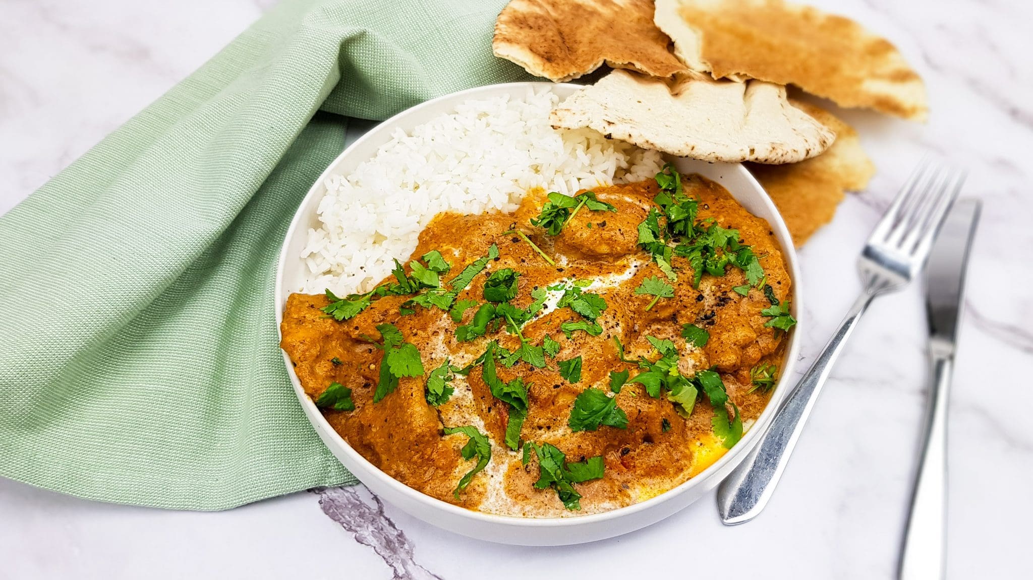 Butter chicken: Tandoori kip in boterige tomatensaus